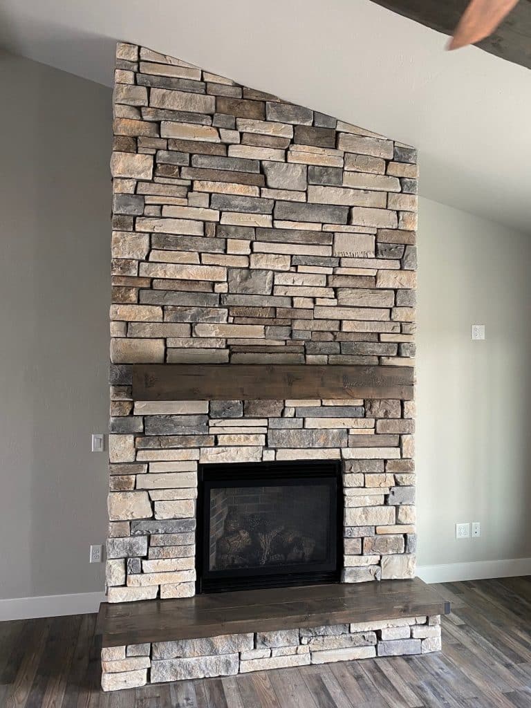 Tall natural stone fireplace