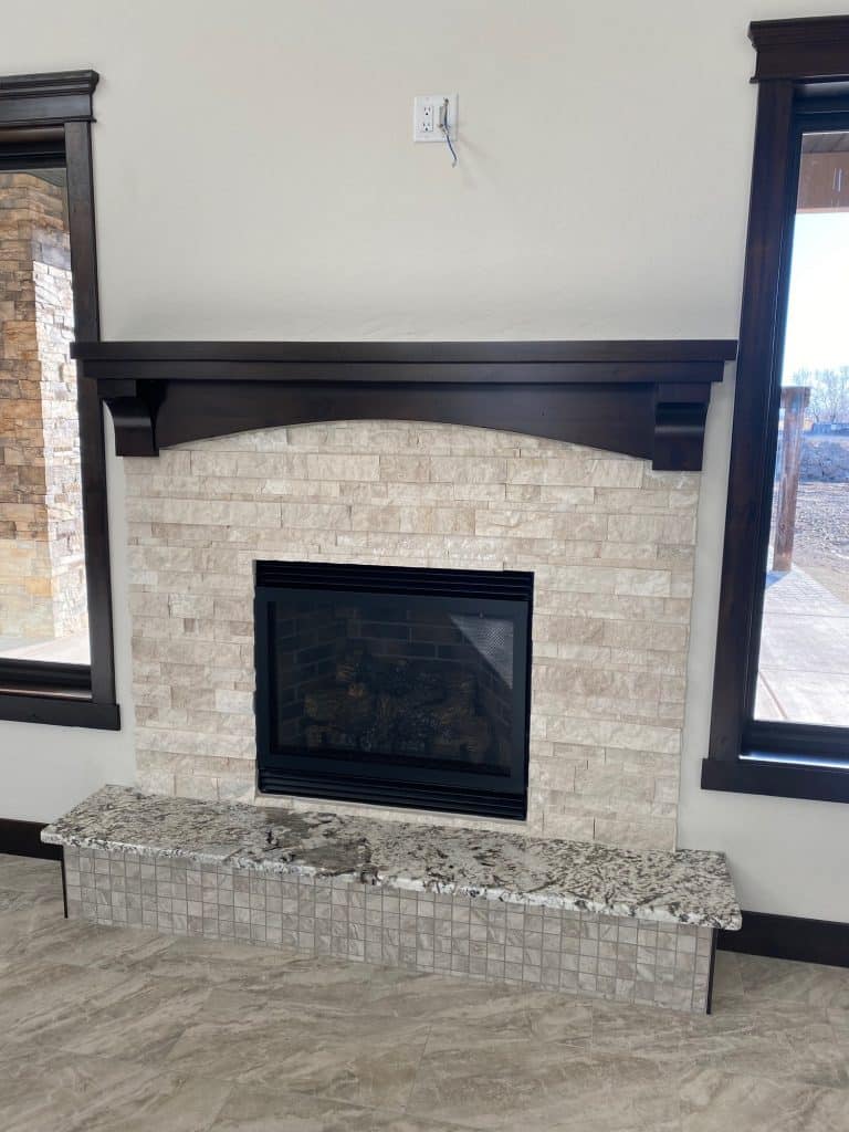 Fireplace with dark wood mantle