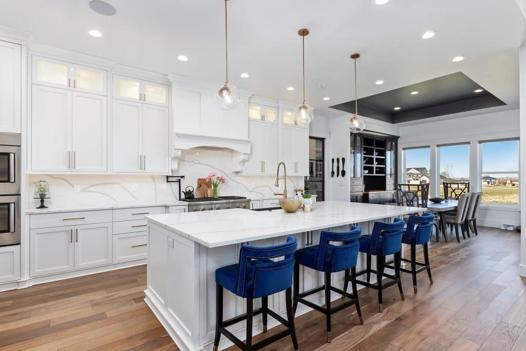 White kitchen with blue chairs